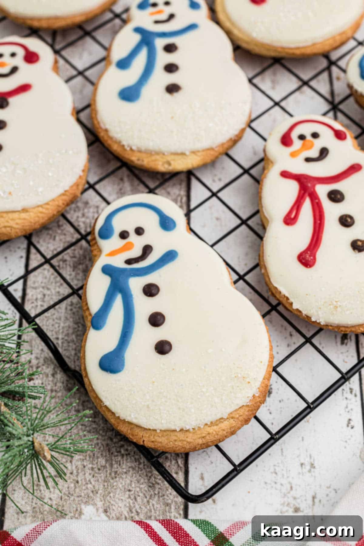 Close up edge of a cooling rack that has a Starbucks snowman cookie recipe.