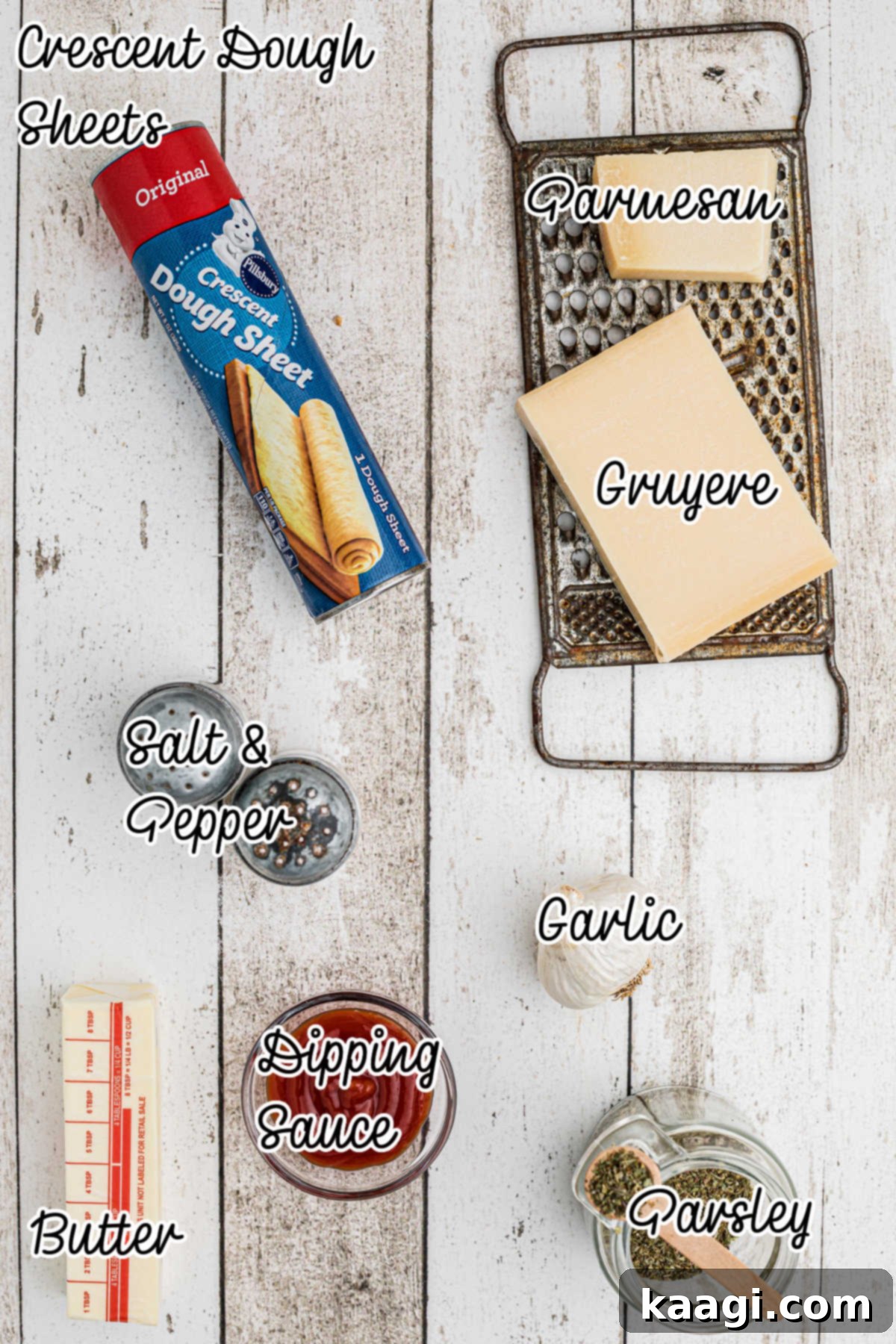 All ingredients for the pull apart bread wreath recipe laid out on a rustic surface.
