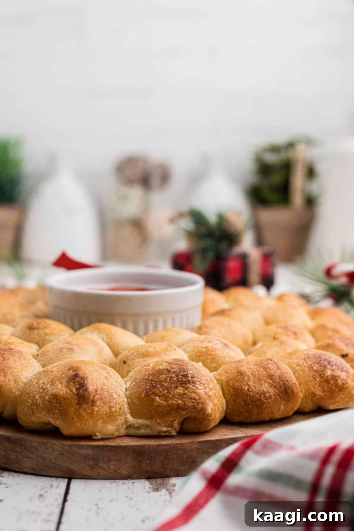 Side angle shot of a pull apart bread wreath for Christmas, showing its rich texture and festive charm.