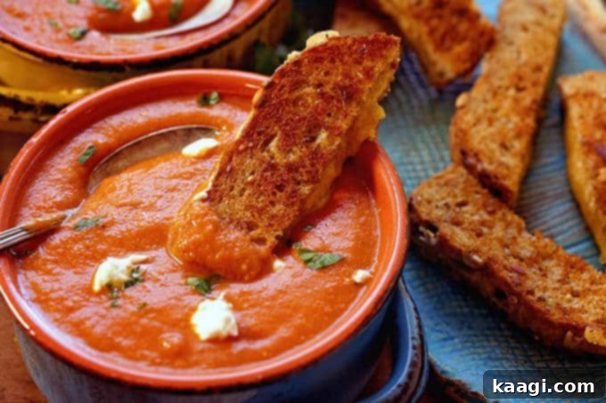 A comforting bowl of creamy Tomato Bisque Soup, garnished and ready to be enjoyed.