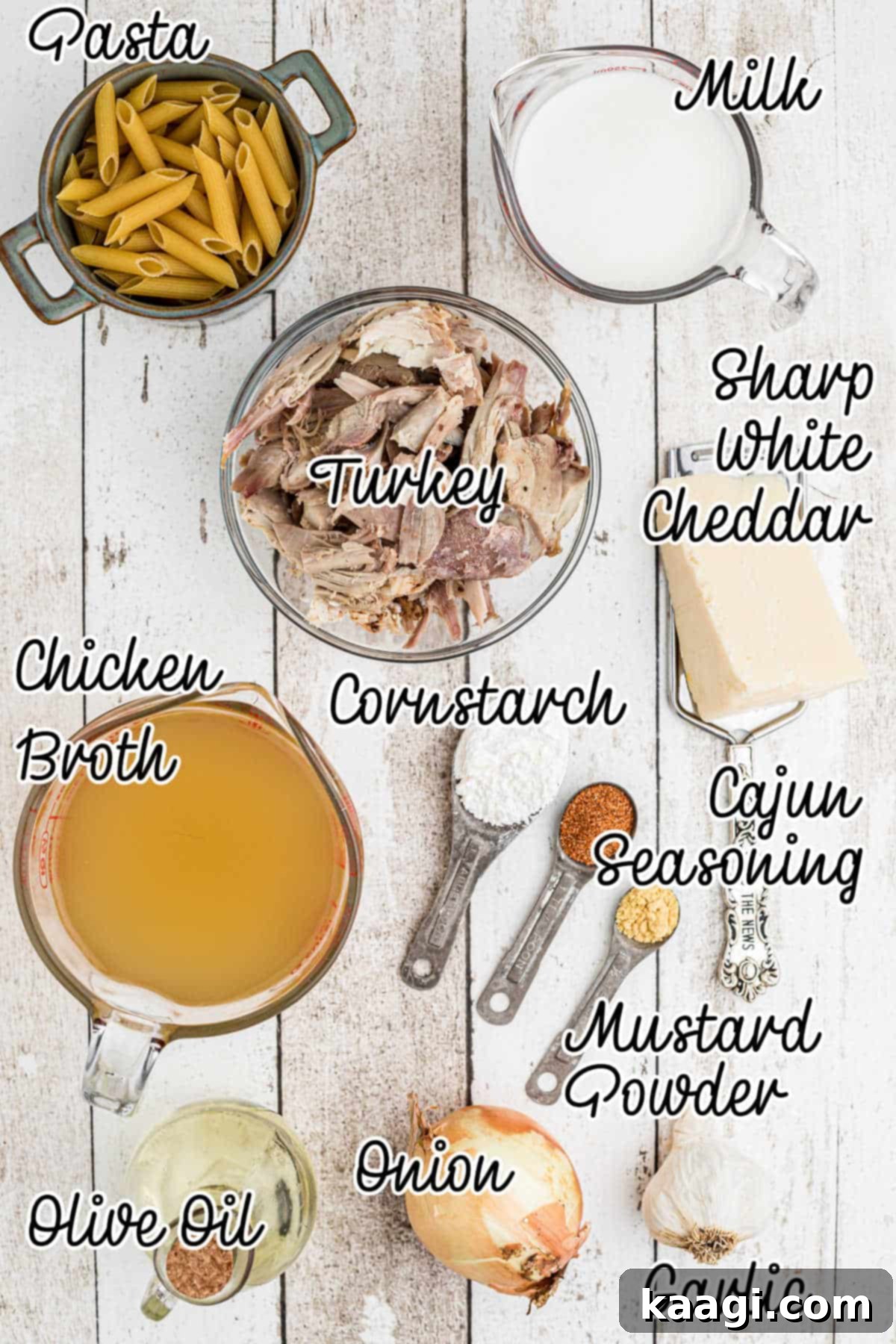 A flat lay photograph showcasing all the ingredients required for making one pot turkey pasta, neatly arranged on a rustic surface.