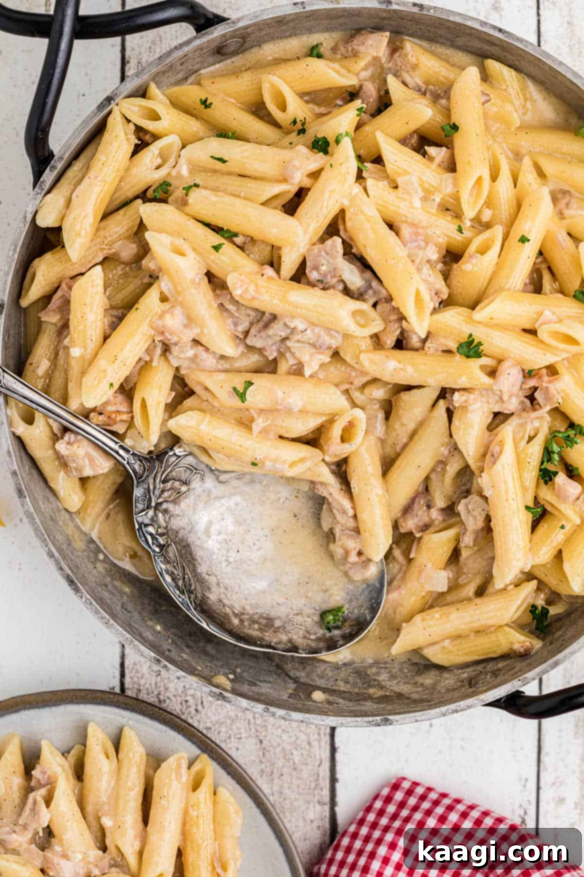 An overhead hero shot of a Dutch oven filled with a rich, creamy one pot turkey pasta, ready to be served.