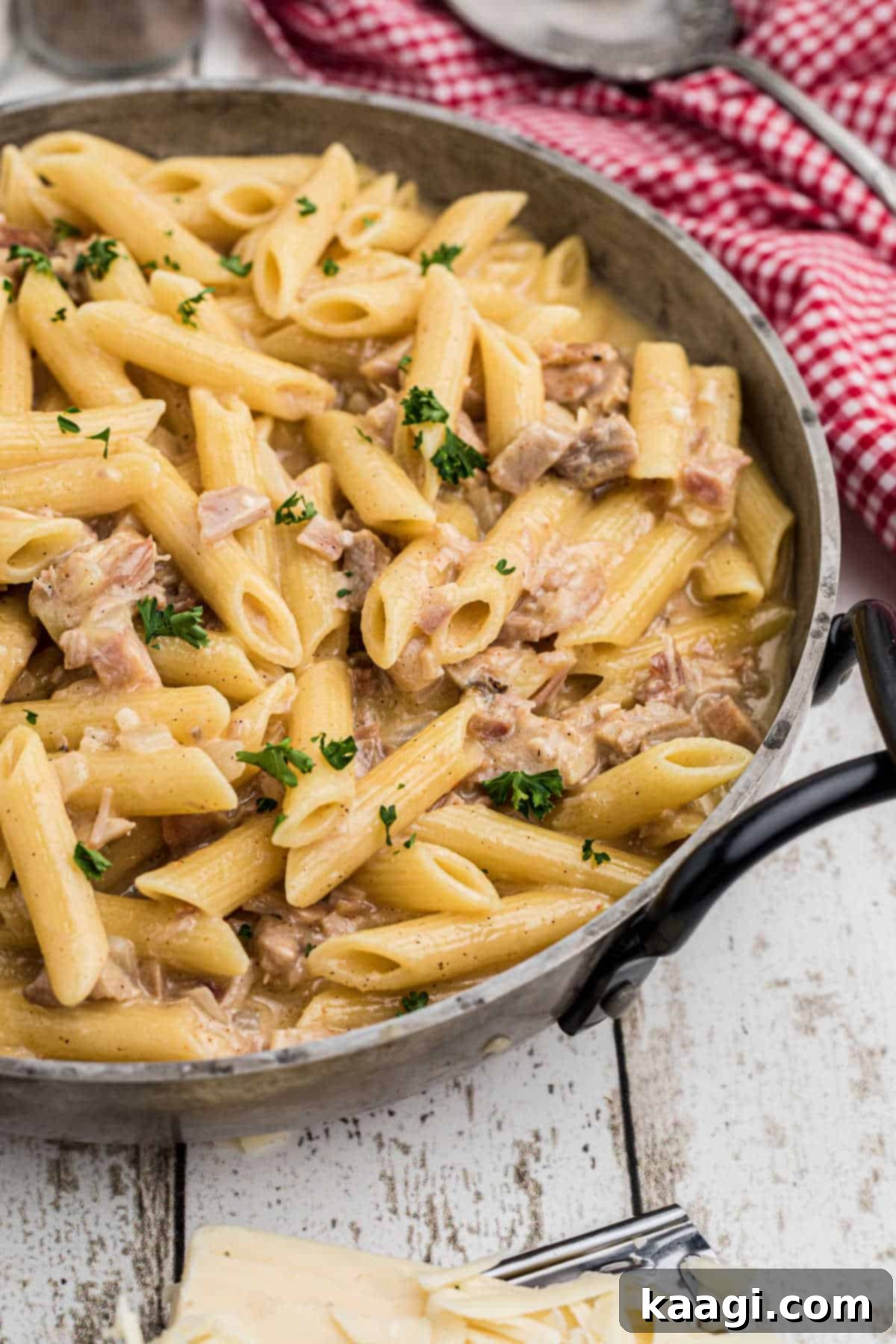 A side shot of a hearty serving of one pot turkey pasta, showcasing its creamy texture and rich color.