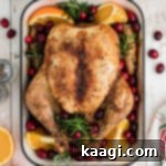 Overhead shot of a Christmas roast chicken, cropped square.