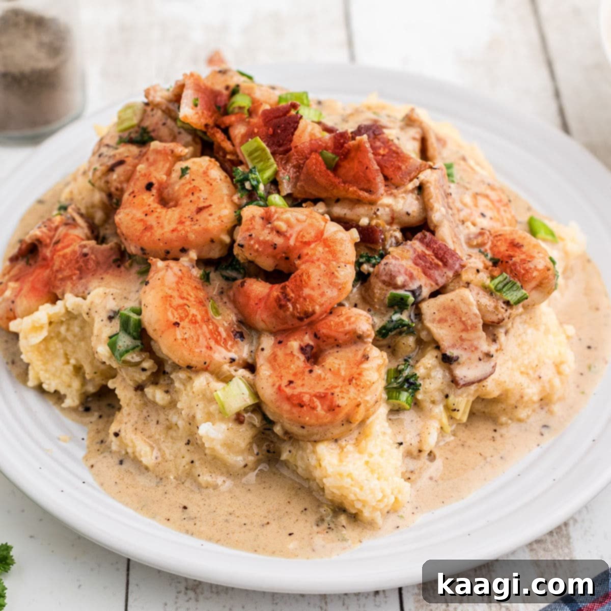 Shrimp and grits with some delicious bacon and green onions sprinkled on top.