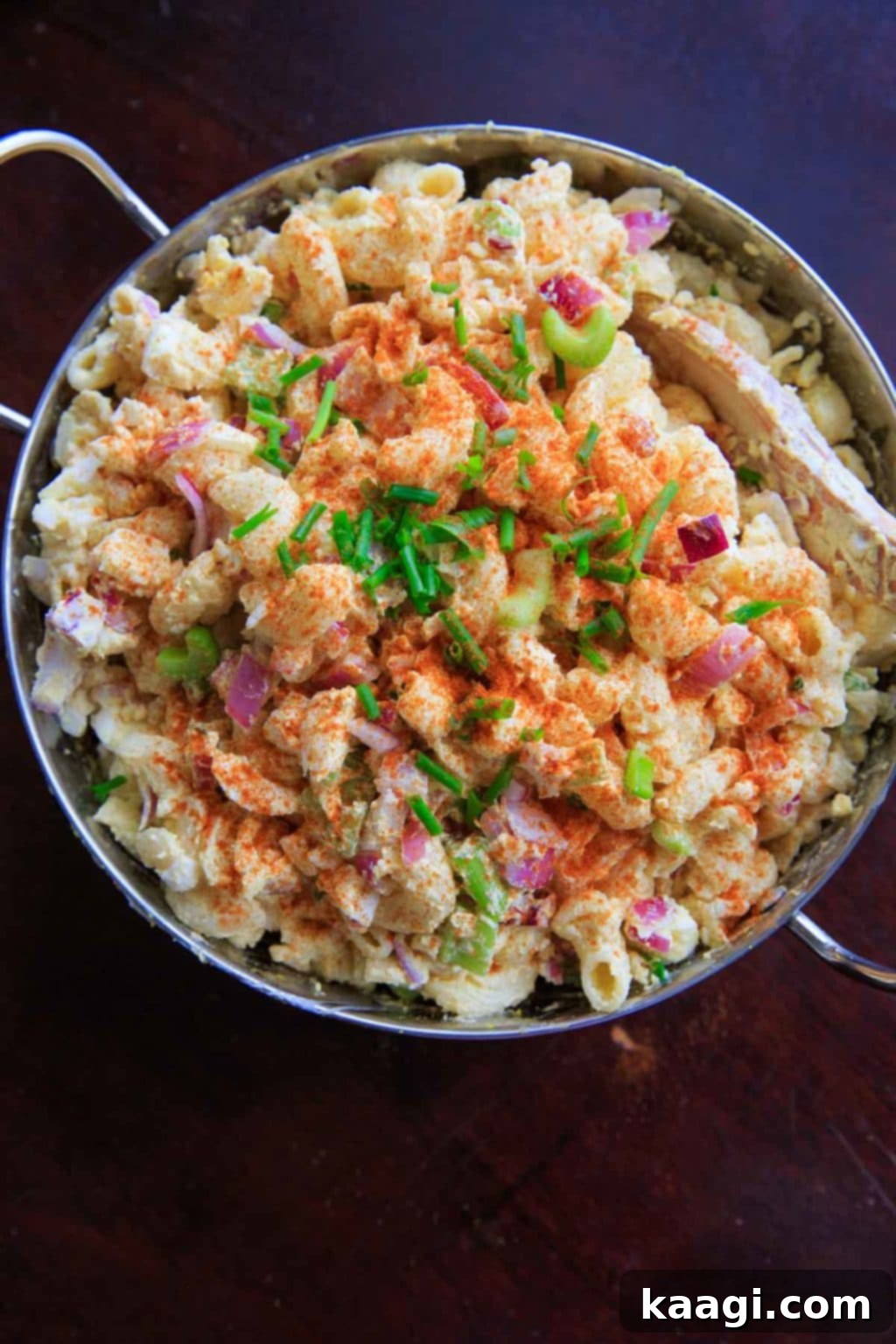 Second Life for Deviled Eggs 7 A colorful and creamy deviled egg pasta salad, featuring spiral pasta and fresh herbs.