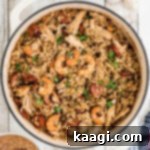 Overhead shot of a Dutch Oven Jambalaya cropped square, highlighting the rich colors and textures.