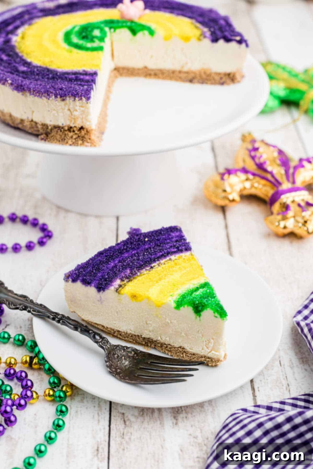 Festive Mardi Gras Cheesecake 2 A slice of mardi gras cheesecake on a festive plate.