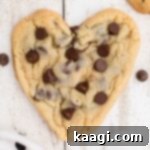 Overhead picture of heart shaped chocolate chip cookies, cropped square.