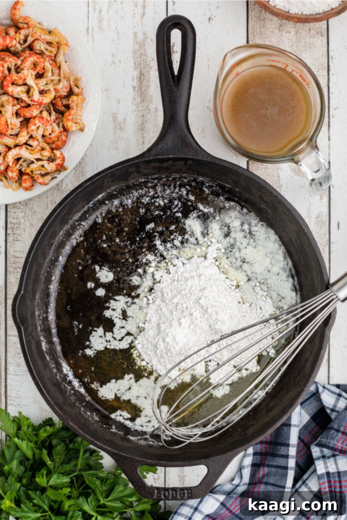 Flour added to a black skillet.
