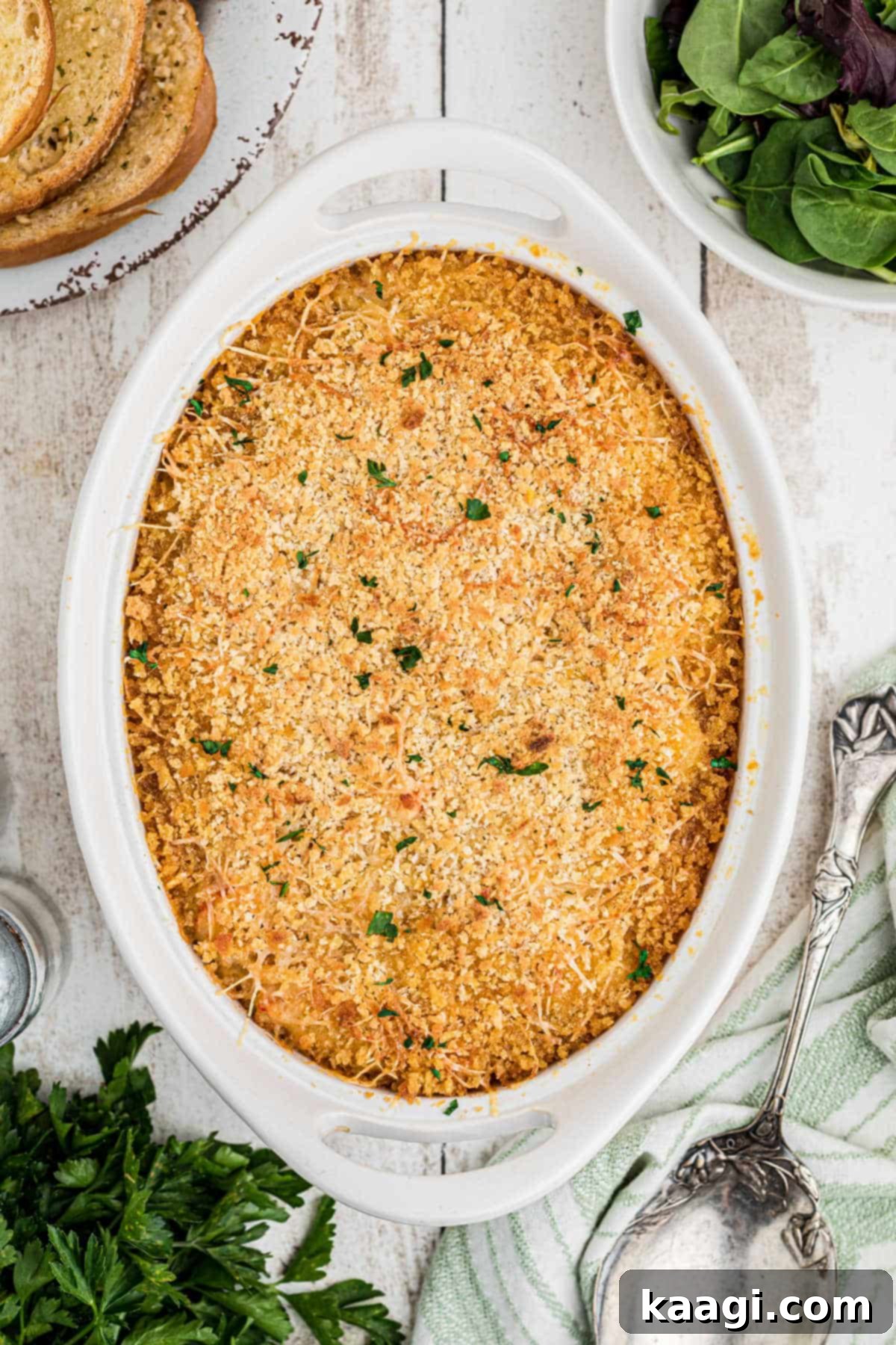 An undisturbed dish full of crawfish au gratin, ready for baking.