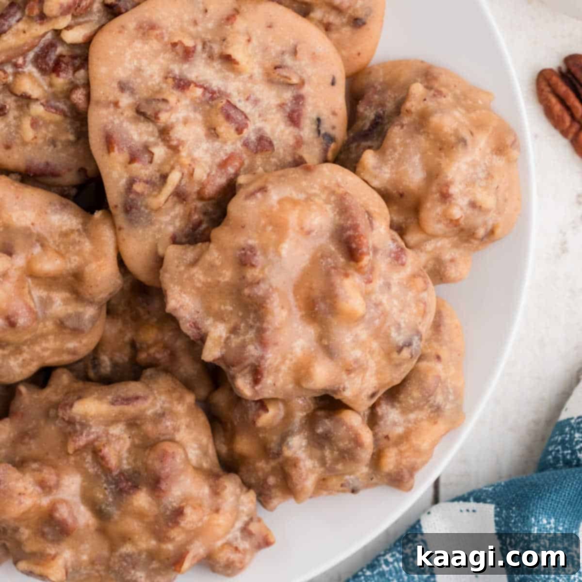 An overhead shot of a plate brimming with golden Pecan Pralines, showcasing their rich, nutty texture.