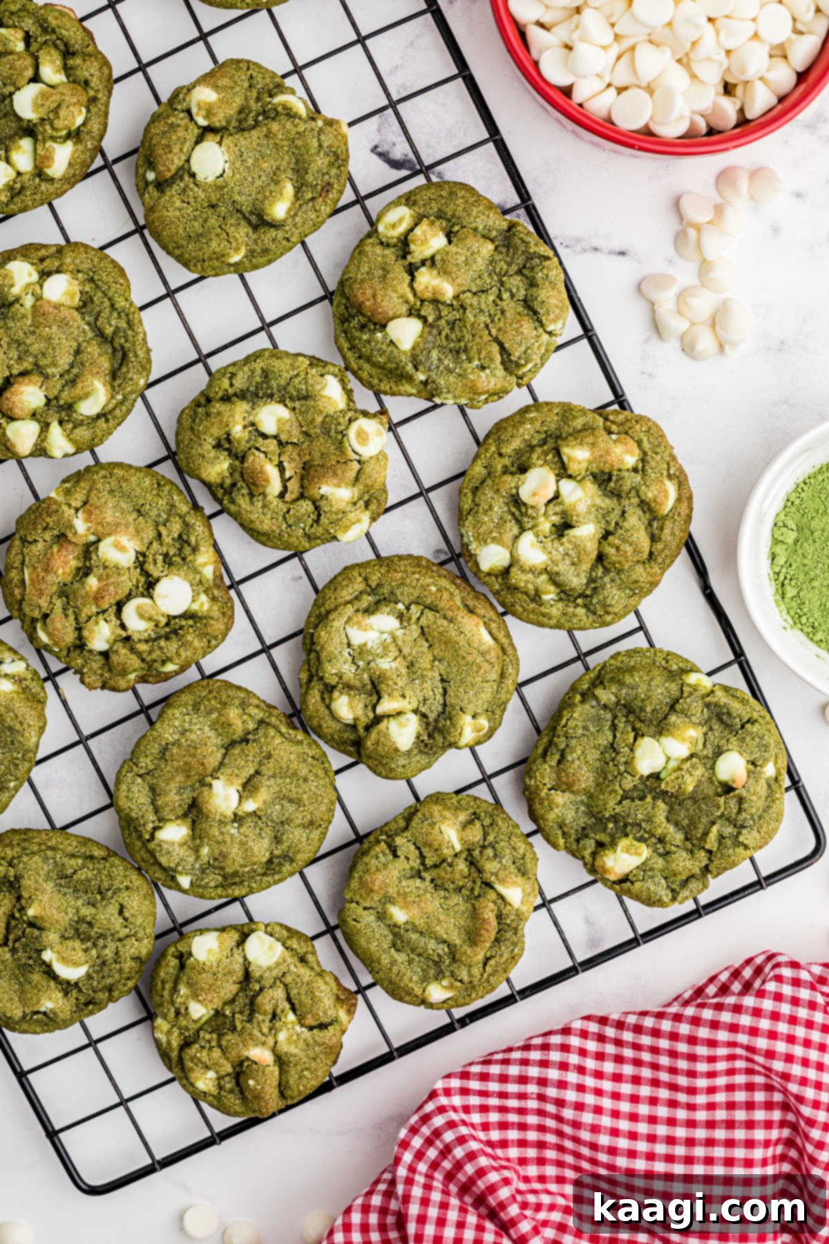 Emerald Matcha Delights 6 An overhead picture of a cooling rack with freshly baked matcha cookies spread out to cool.
