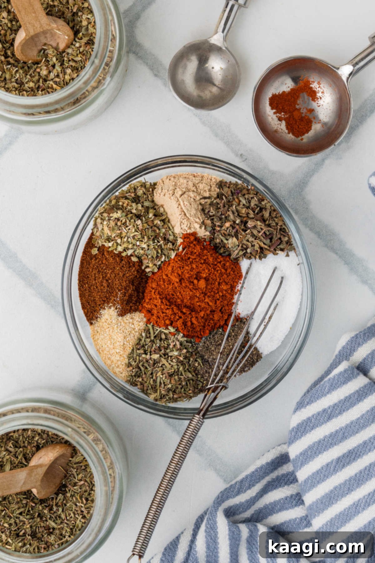 Blackened Spice Symphony: Your Kitchen's Cajun Secret 4 Mixing herbs and spices in a glass bowl